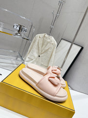FENDI BAGUETTE SLIPPERS IN PASTEL PINK LAMBSKIN WITH GOLD HARDWARE