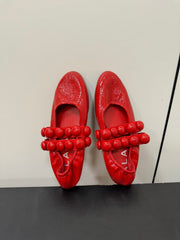 ALAIA SPHERE BALLET FLATS IN CHERRY RED LAMBSKIN