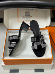 HM 25S ORAN HIGH‑HEEL SANDAL 50 MM IN BLACK LAMBSKIN WITH WHITE STONE DETAILS